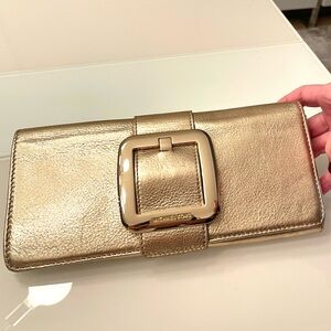 Brand NEW Micheal Kors clutch bronze color